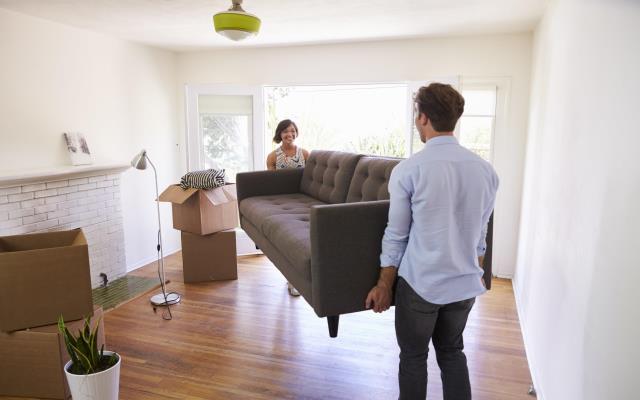 Home buyers checklist couple sofa Home buyers checklist couple sofa