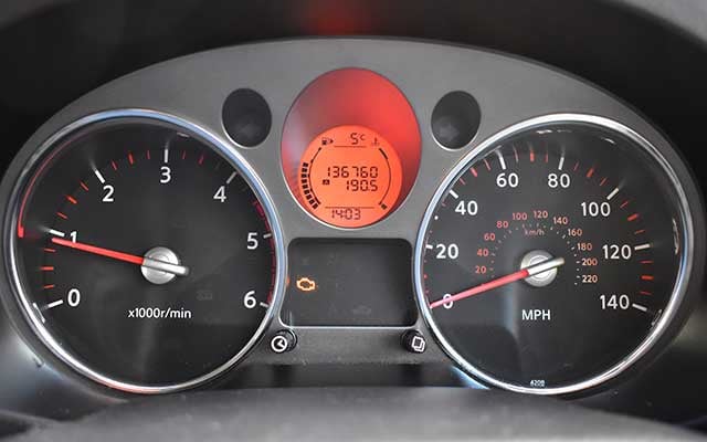 Engine management light lit up on car dashboard